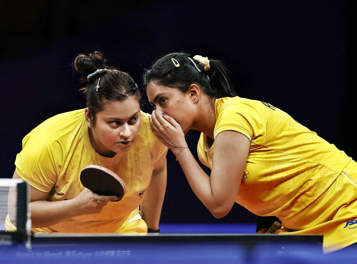 Plotting the line of action: India’s Sutirtha Mukherjee and Ayhika Mukerjee discuss strategies during a women’s doubles semifinal match. Plotting the line of action: India’s Sutirtha Mukherjee and Ayhika Mukerjee discuss strategies during a women’s doubles semifinal match.